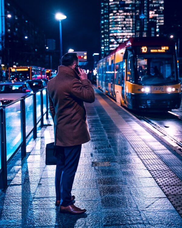 A Man in a Coat Having a Phone Call